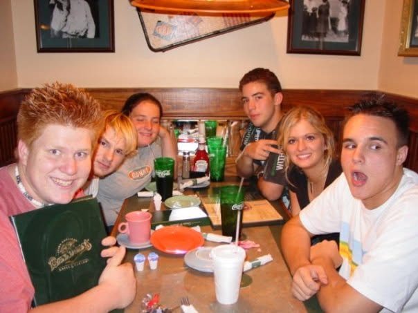 Jared Guynes and friends crowded into a booth at Bennigan's