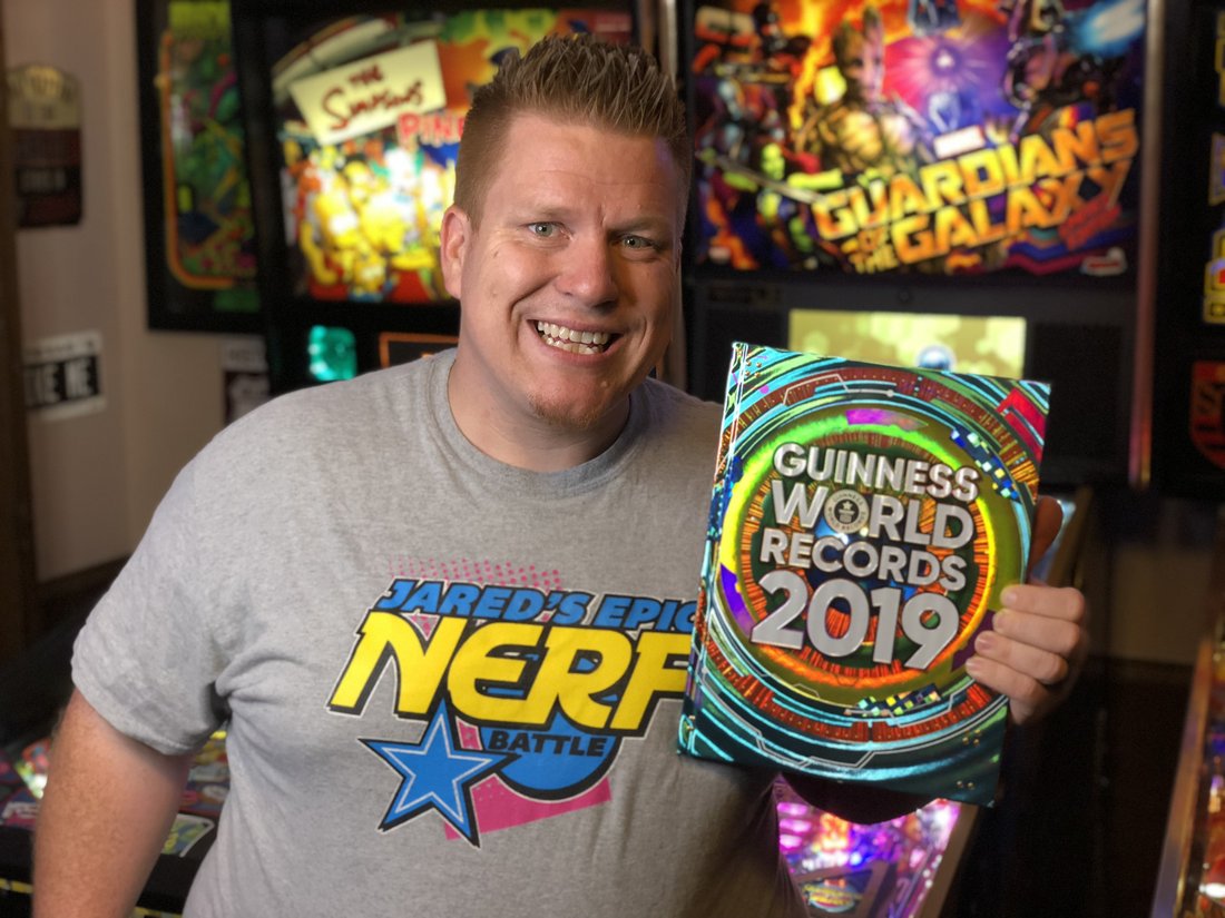 Jared Guynes holding the Guinness World Records 2019 book