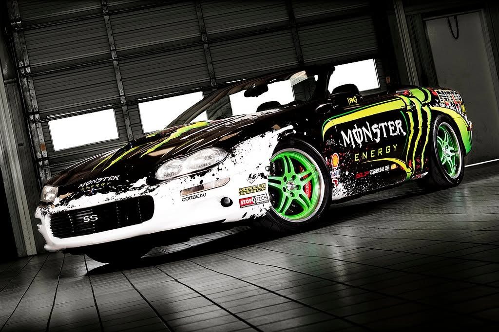 Jared's Camaro in its white and black Monster Energy livery inside a garage