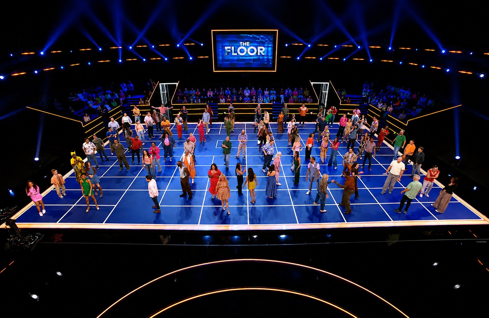 The Floor Season 6 set, with the hundred contestants standing on the lit grid under the show's screen